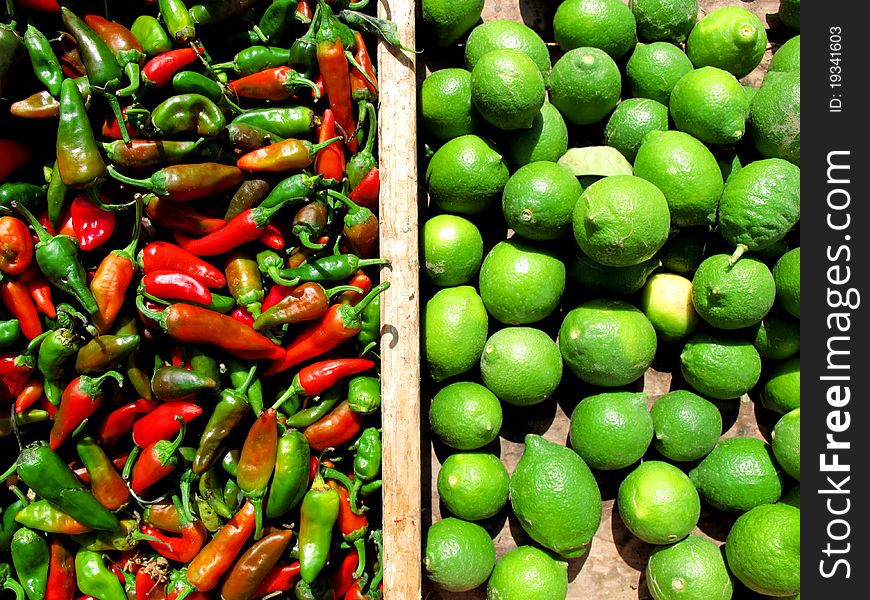 Chilli, pepper and limes on a market. Chilli, pepper and limes on a market