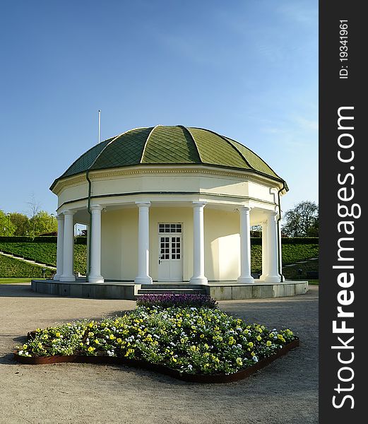 Ancient building with columns in spring Swedish park. Ancient building with columns in spring Swedish park