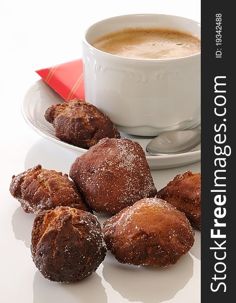 Traditional spanish fritters and a white coffee