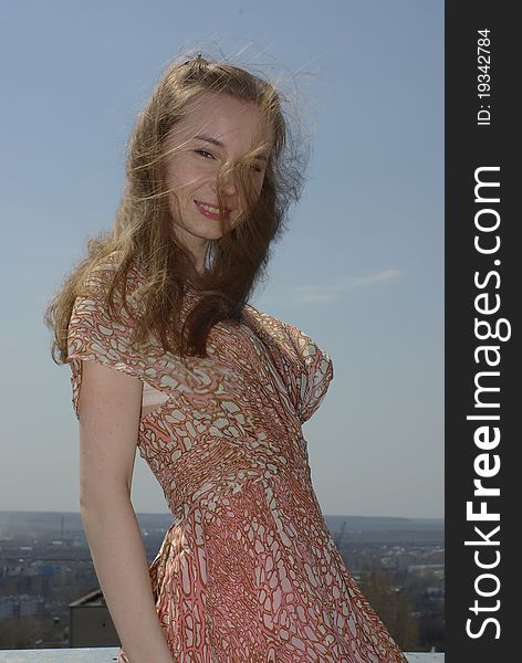 Girl with loose hair floating in the wind