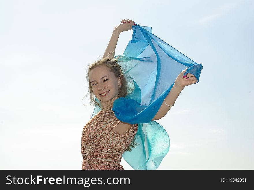 Happy young girl with a blue pareo. Happy young girl with a blue pareo