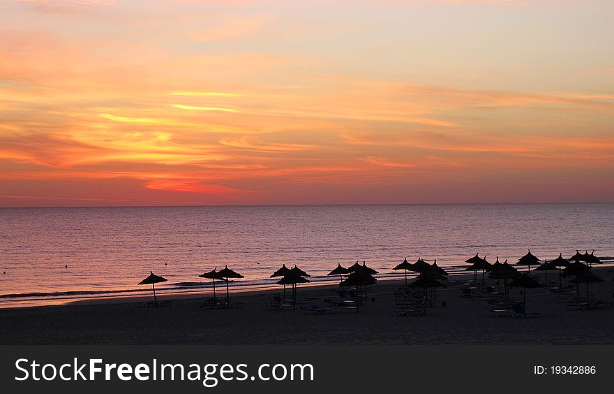 Sunrise on the beach in a beach resort in Tunesia