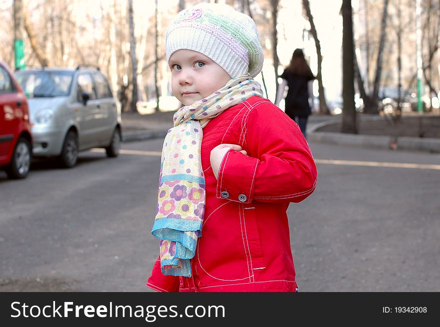 Pretty little girl walking on the street. Pretty little girl walking on the street.