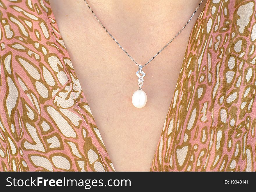 White pearl pendant on a silver chain