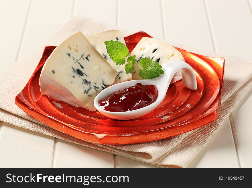 Blue cheese and spoon of fruit preserve