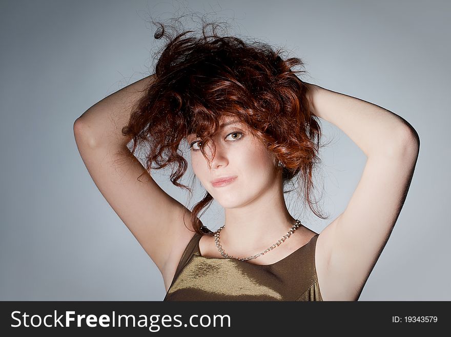 Red haired woman playing with haircut. Red haired woman playing with haircut