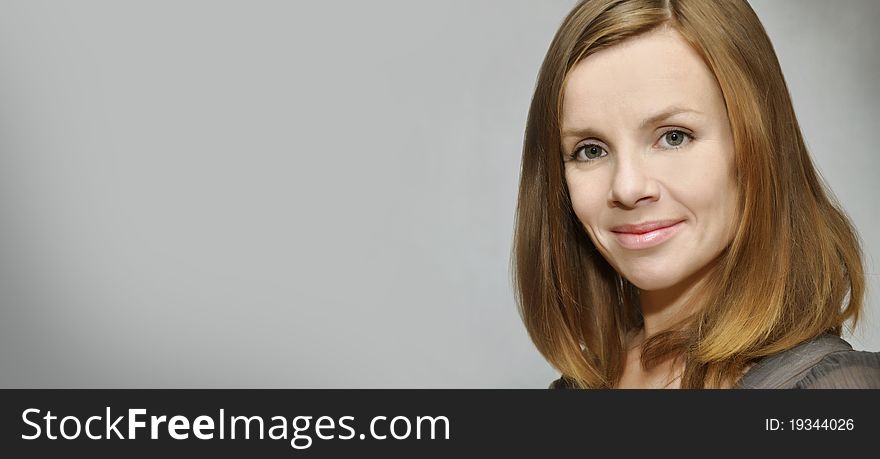 Portrait of a smiling girl with a field for labels. Portrait of a smiling girl with a field for labels