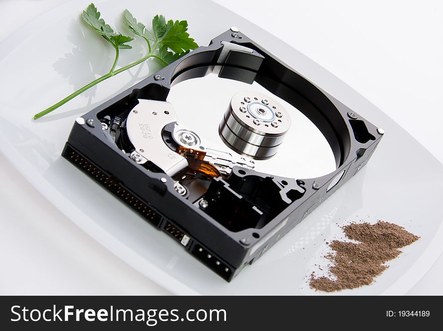 Hard drive on the dining plate with seasoning and herbs. Hard drive on the dining plate with seasoning and herbs