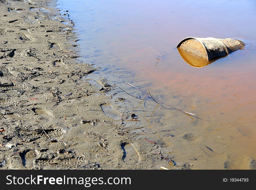 Rusty Barrel Pollutes Alaska River. Rusty Barrel Pollutes Alaska River