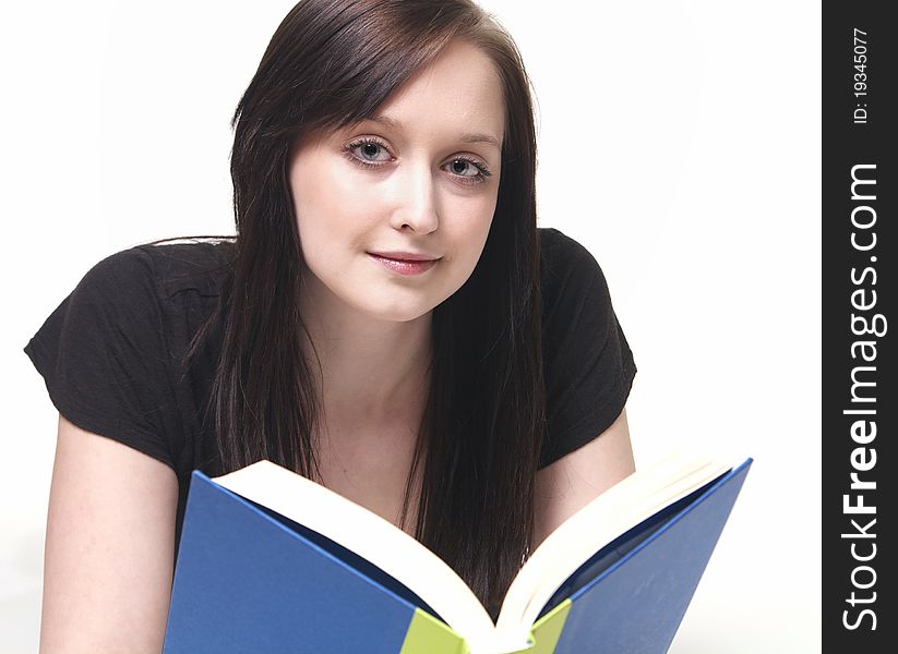 An attrative student reads a book while contemplating her future. An attrative student reads a book while contemplating her future.