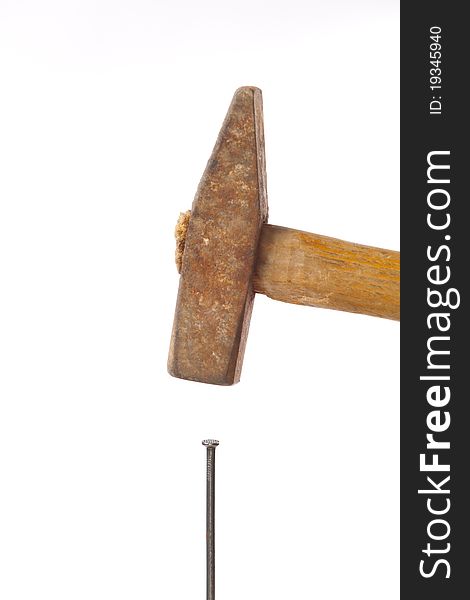 Hammer and nail on white background