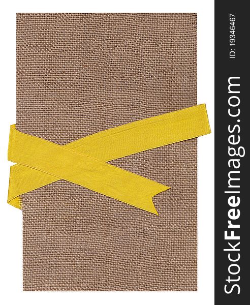 Textile background.Gold ribbon on a fabric.