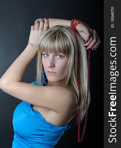 Woman in blue dress with beads