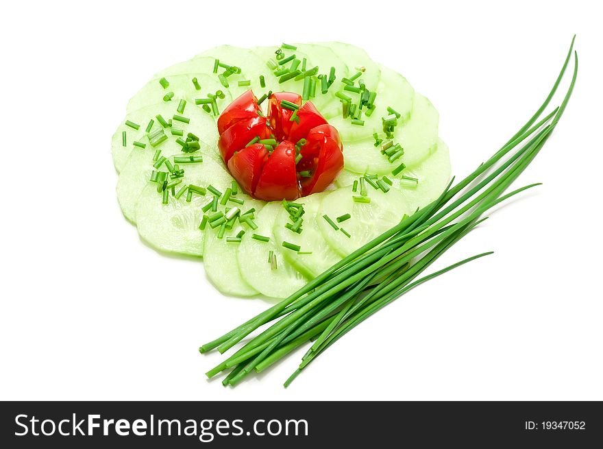 Salad with cucumber, tomato and chives over a white background