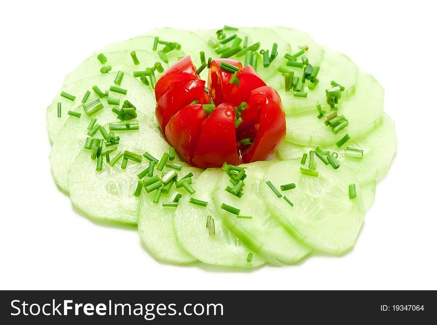 Salad with cucumber, tomato and chives over a white background