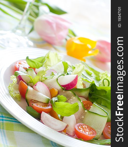 Fresh salad from raw vegetables and lettuce