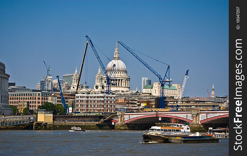 View of London with construction cranes.