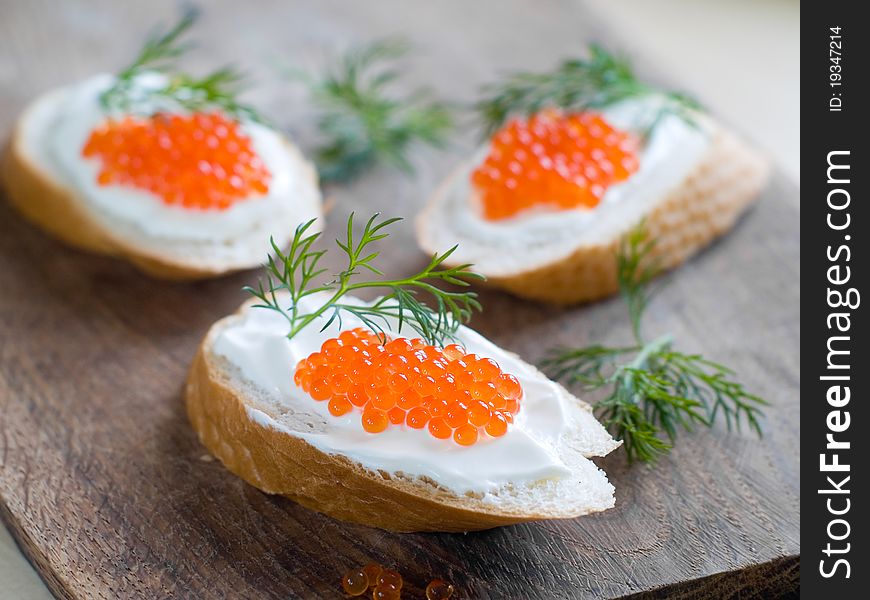 Bread with fresh cream cheese and red caviar. Bread with fresh cream cheese and red caviar