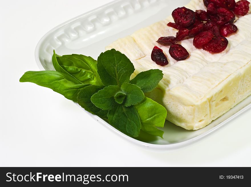Soft ripened cheese with  basil leaves