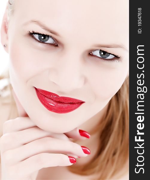 Face of an attractive woman with red lips and nails. Face of an attractive woman with red lips and nails