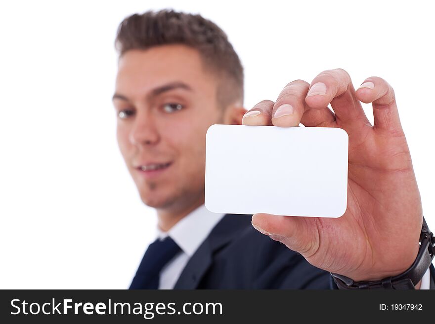 Business man handing a blank business card over white background, focus on hand and card