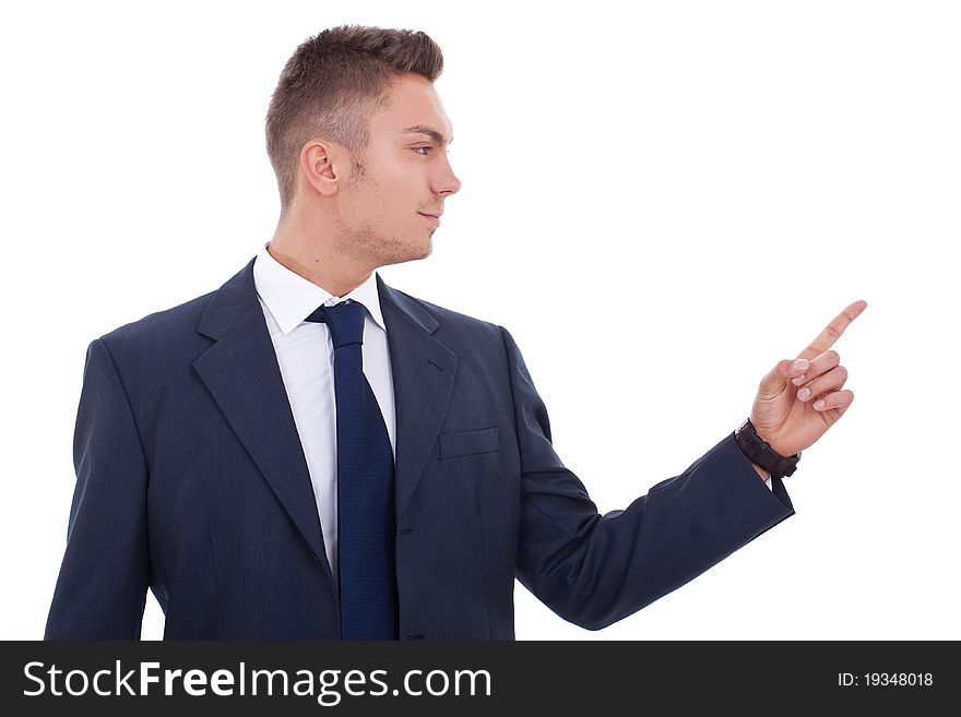 Young business man pointing to the side of the image