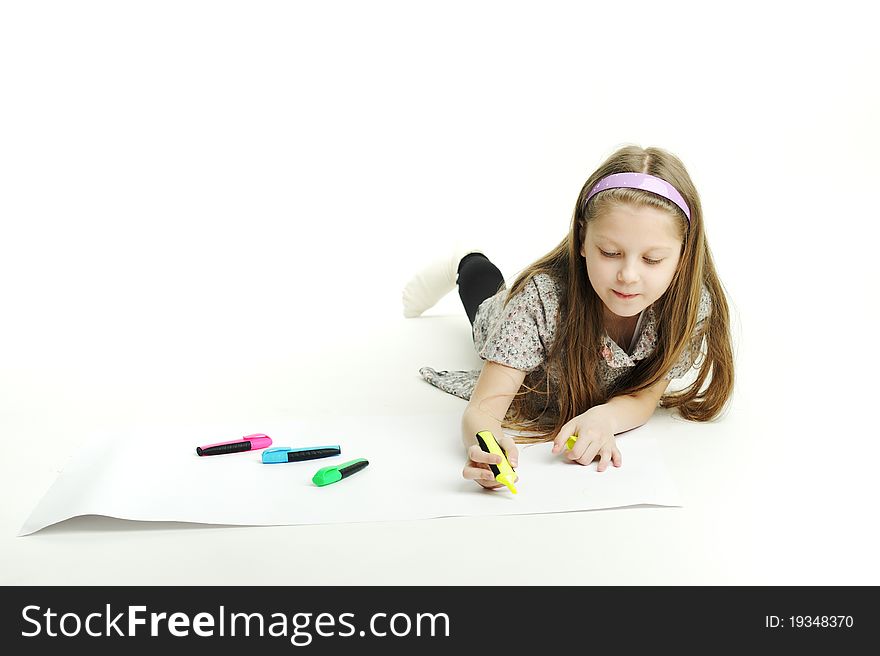 An image of a little girl drawing a picture. An image of a little girl drawing a picture