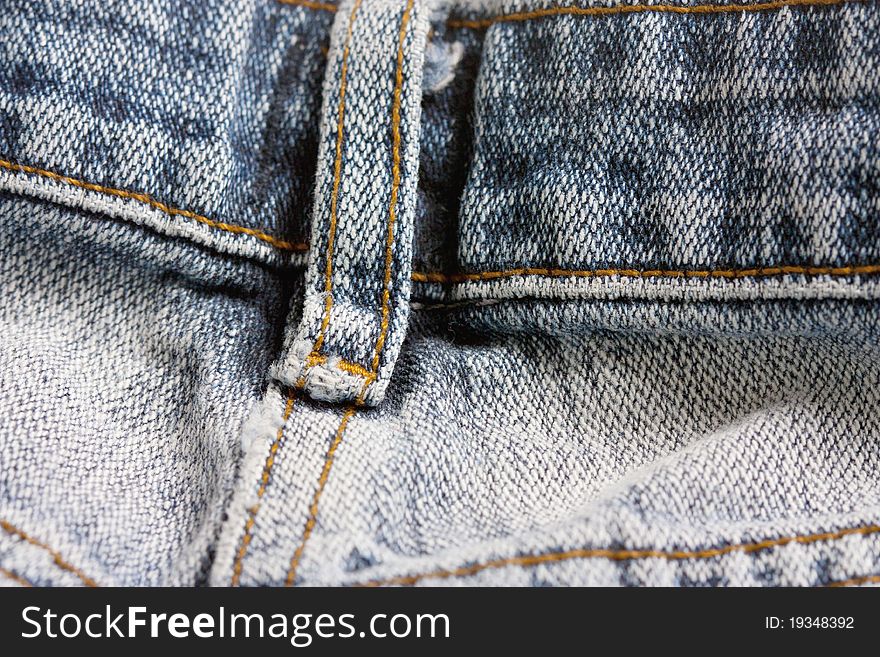 Macro studio shot of close up of jeans belt loop. Macro studio shot of close up of jeans belt loop