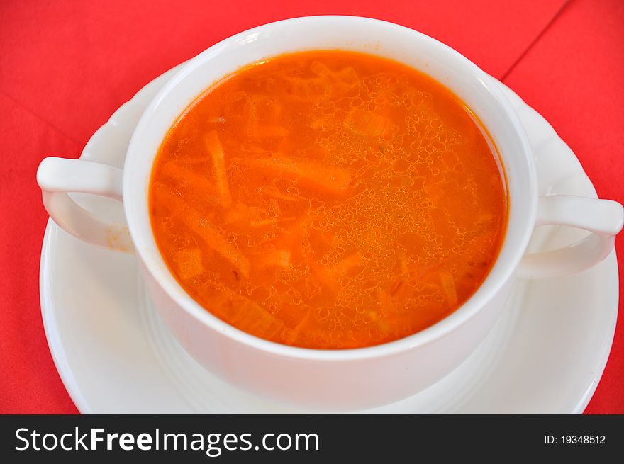 A delicious tomato soup on a red napkin