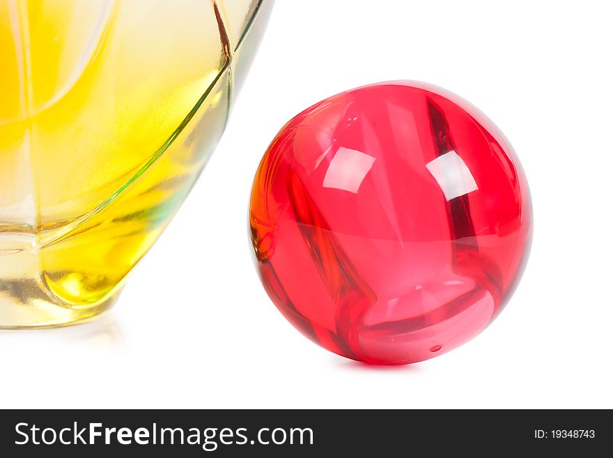 Colorful transparent perfume bottle over white background