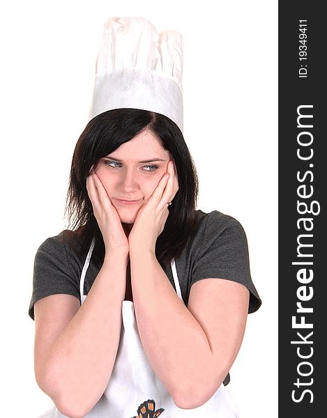 A lovely portrait of a young woman with an apron and cooking hat,
thinking, for white background. A lovely portrait of a young woman with an apron and cooking hat,
thinking, for white background.