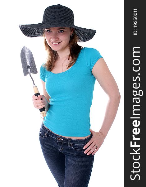 Woman holding a gardening shovel. Woman holding a gardening shovel