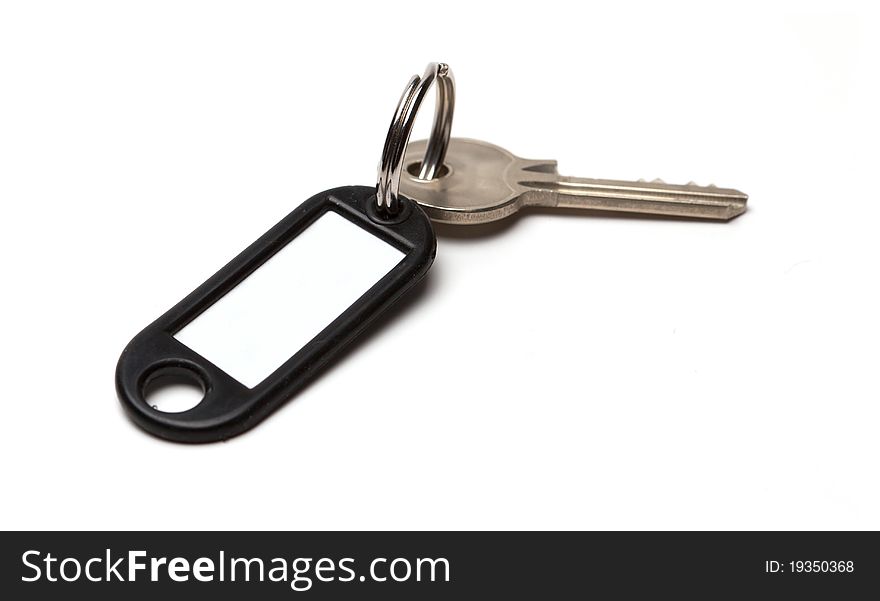 Key with clean tag isolated on white background. Key with clean tag isolated on white background.