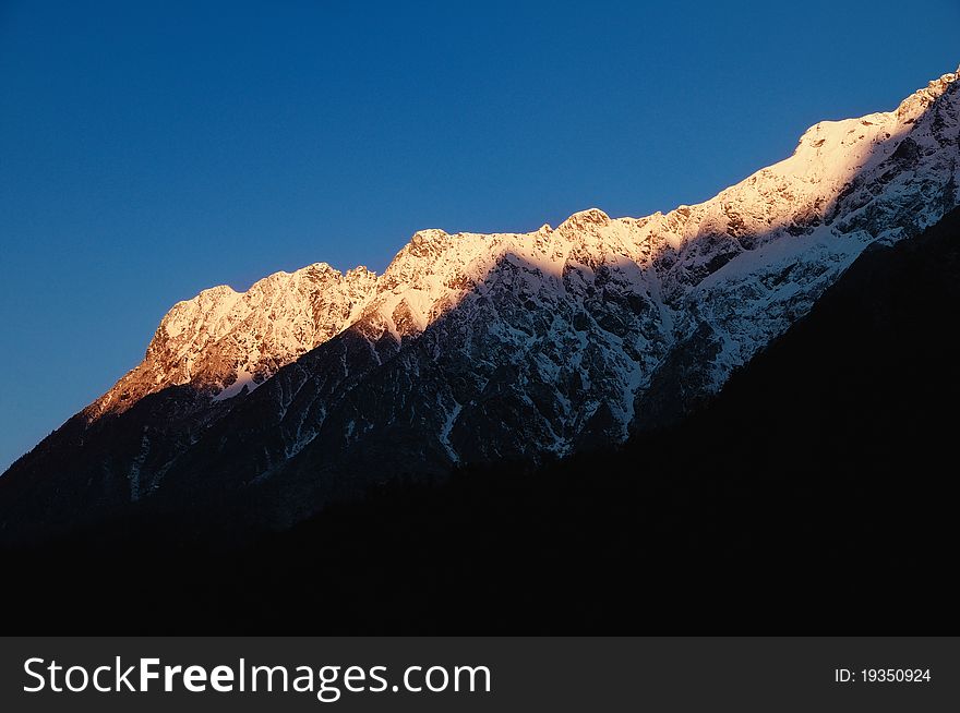 First rays of dawn falling on the snow-capped himalayan peaks. First rays of dawn falling on the snow-capped himalayan peaks