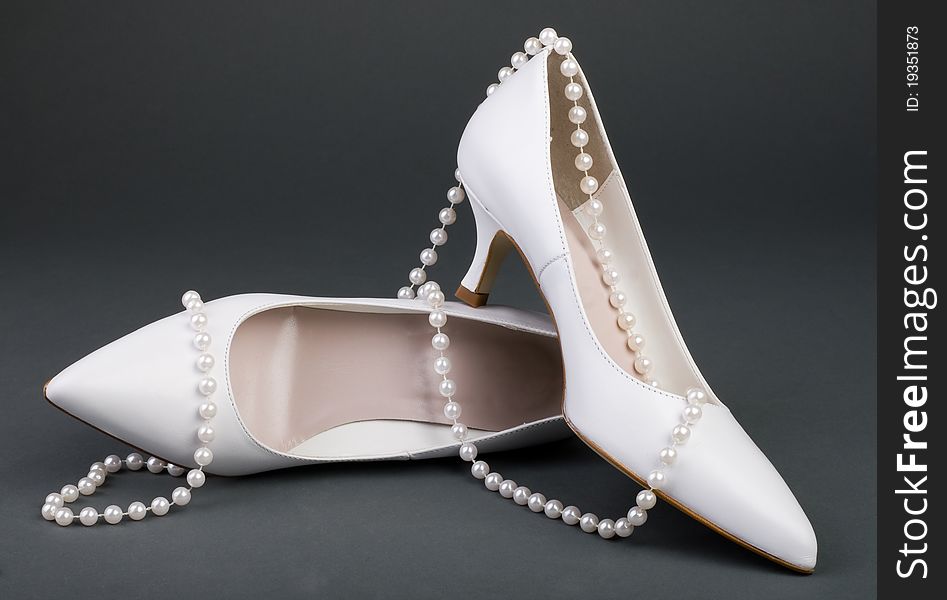 White wedding shoes with pearl. White wedding shoes with pearl
