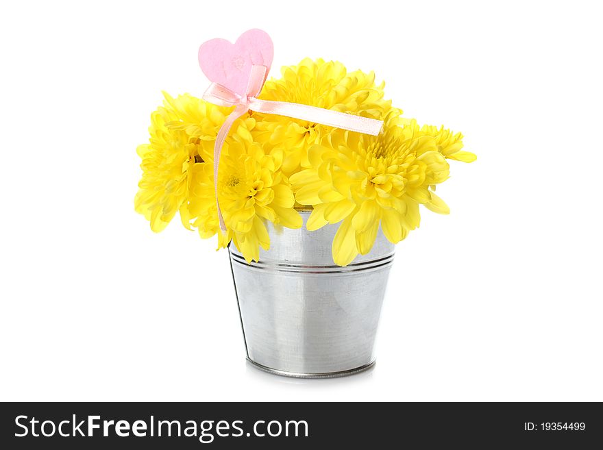 Yellow chrysanthemums in a bucket with chrysanthemums next with the text I love you and a red heart. Isolated. Yellow chrysanthemums in a bucket with chrysanthemums next with the text I love you and a red heart. Isolated