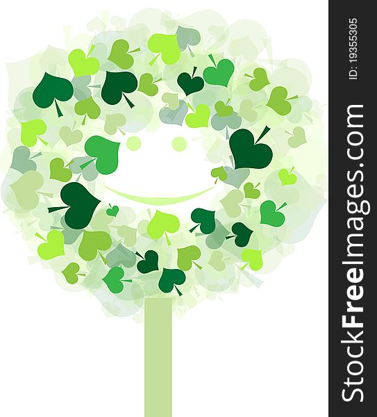 Green tree with eyes and smile