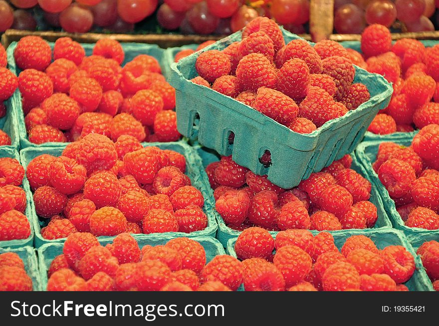 Baskets of fresh red raspberries at the market. Baskets of fresh red raspberries at the market