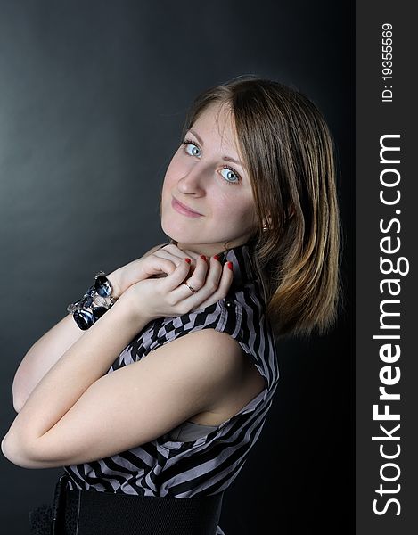 Slim girl in studio on black background