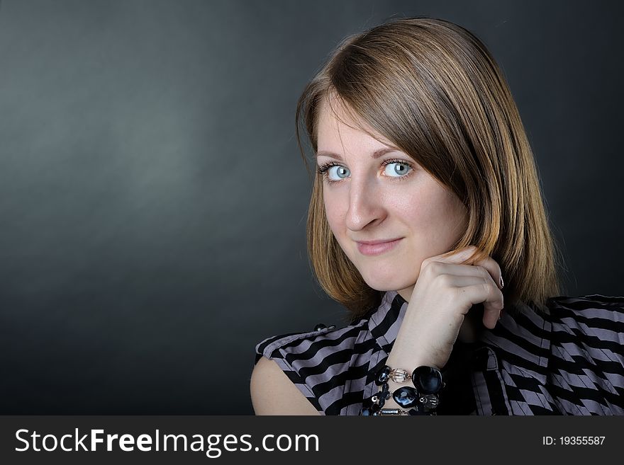 Slim girl in studio on black background