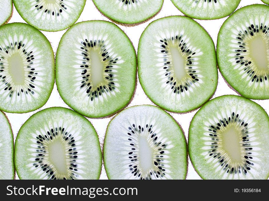 Kiwi background, closeup on white