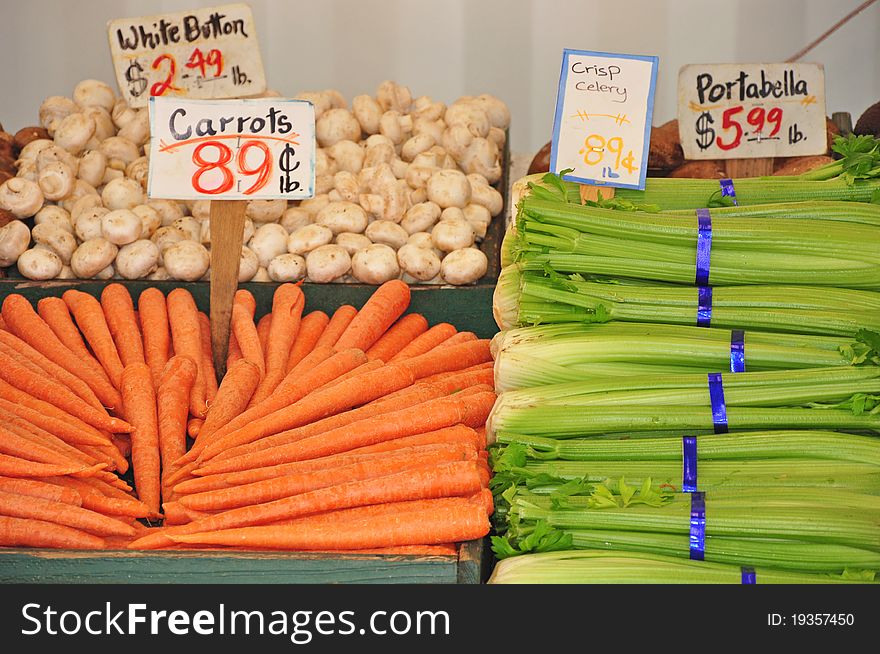 Carrots, mushrooms and celery at the market. Carrots, mushrooms and celery at the market