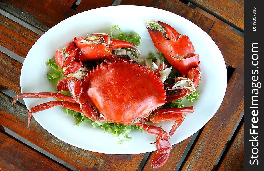 Cooked crabs on white plate