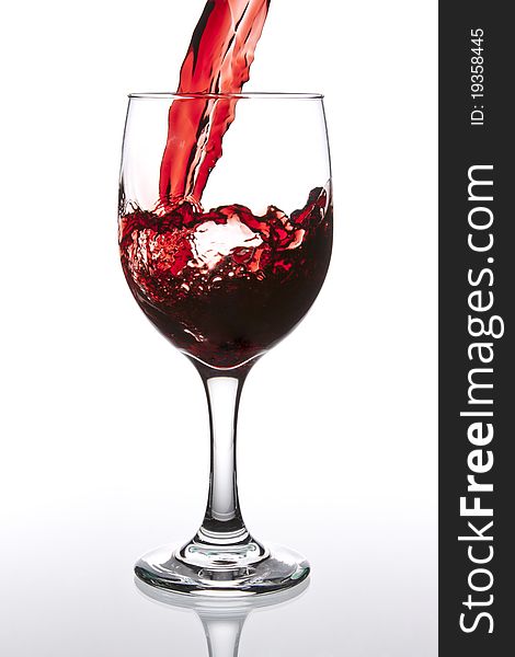 Pouring Red Wine with reflection