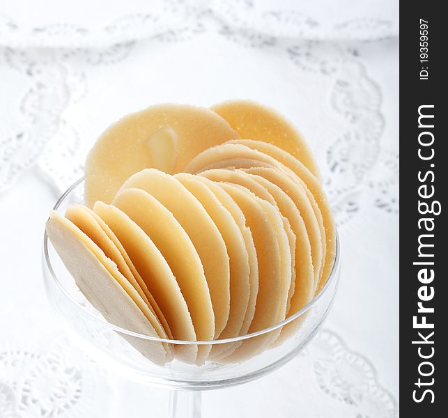 Round crispy biscuit arrangement in glass best for coffee break an image isolated