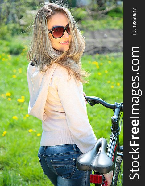 Outdoor shoot of young woman with bicycle