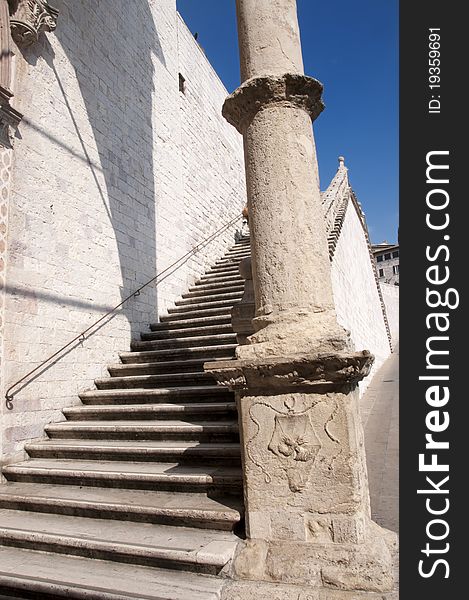 Particular of a column and stair of Saint Francis basilica in Assisi