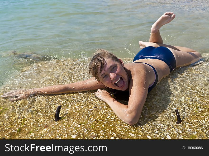 A Girl Lying On The Beach