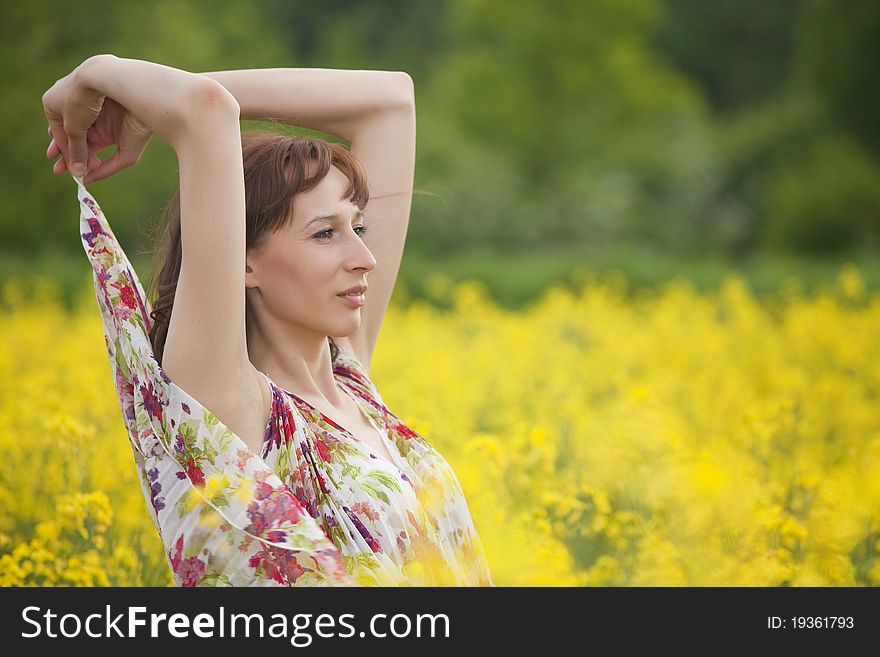 Happy woman in yellow spring field. Happy woman in yellow spring field