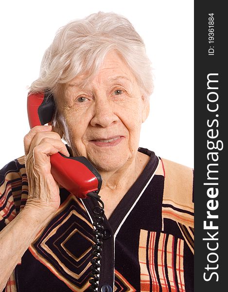 The elderly woman speaks on the phone